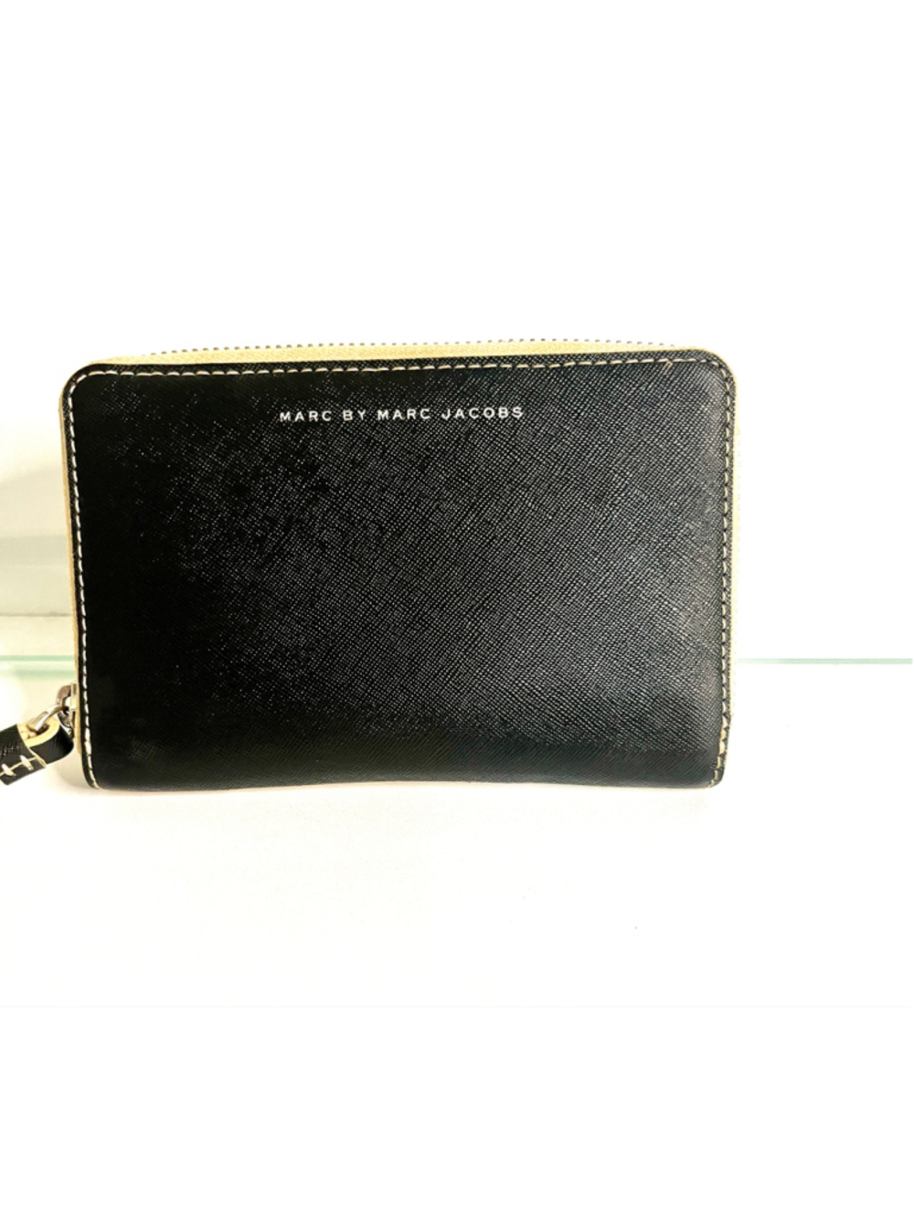 Marc by Marc Jacobs zip-around wallet features black Saffiano leather